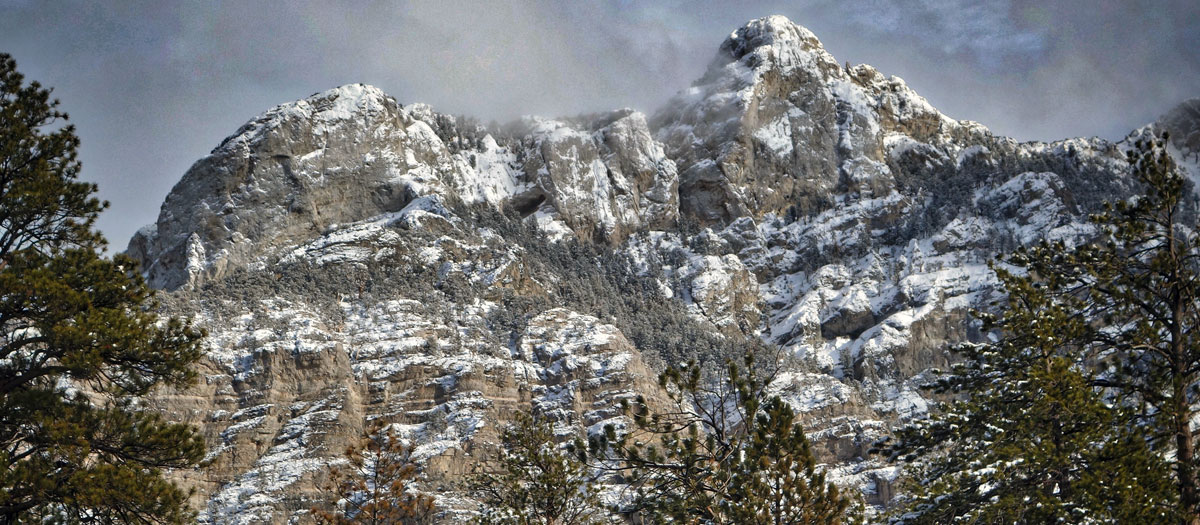 Scenic photo of snow covered mountains at Kyle Canyon on Mount Charleston. Photograph by Ed Foster. 